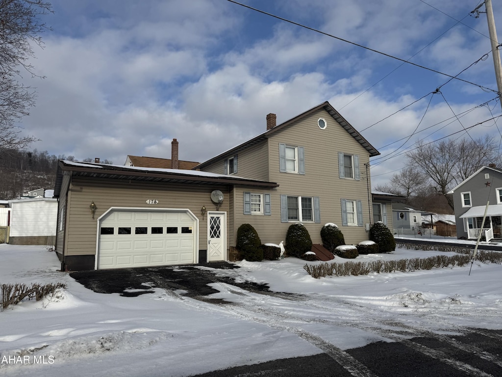 front of property with a garage