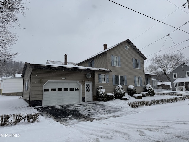 view of front of property with a garage