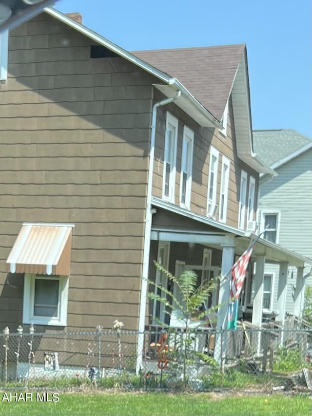 1243 R Main St, Johnstown, PA 15905 - view of property exterior with a shingled roof