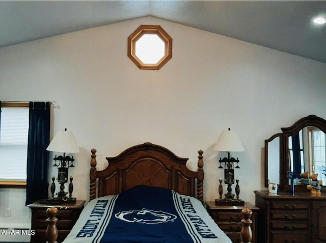 bedroom with lofted ceiling