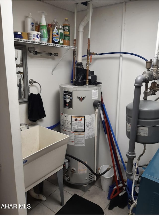 utility room featuring water heater