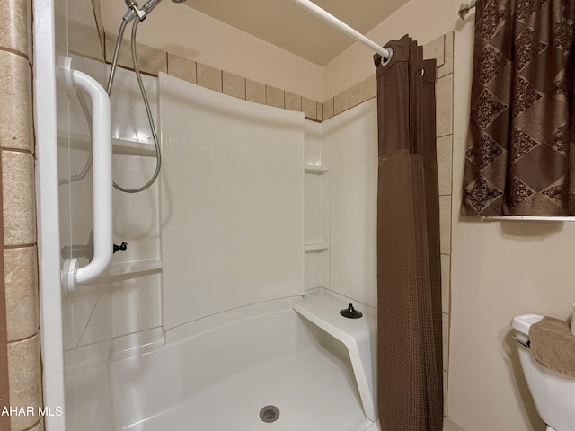 bathroom with a shower with shower curtain