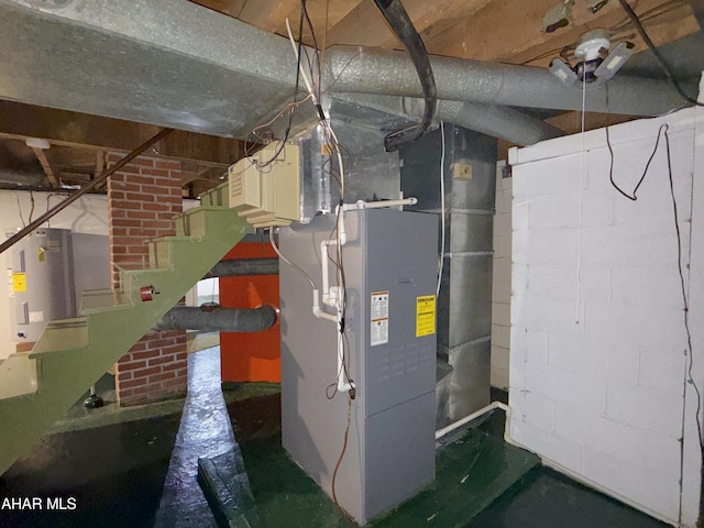 utility room featuring water heater