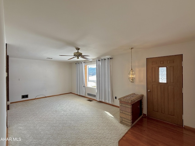 entrance foyer featuring ceiling fan and wood-type flooring