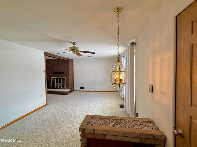 interior space with a chandelier and carpet flooring