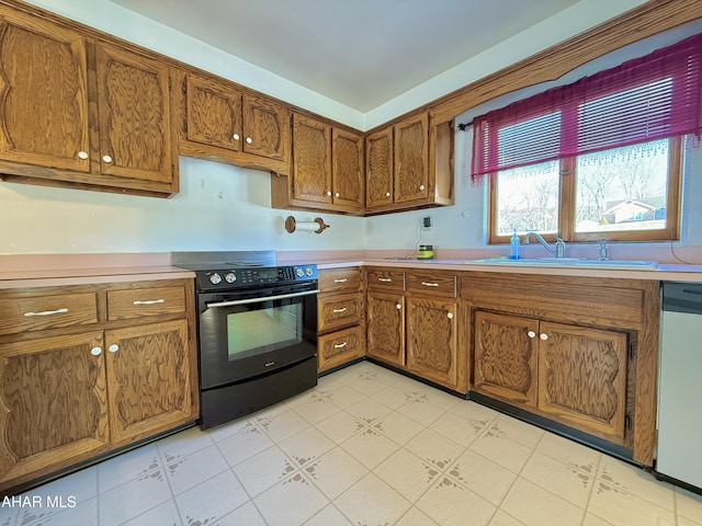 kitchen featuring light tile patterned floors, stainless steel dishwasher, black / electric stove, and sink