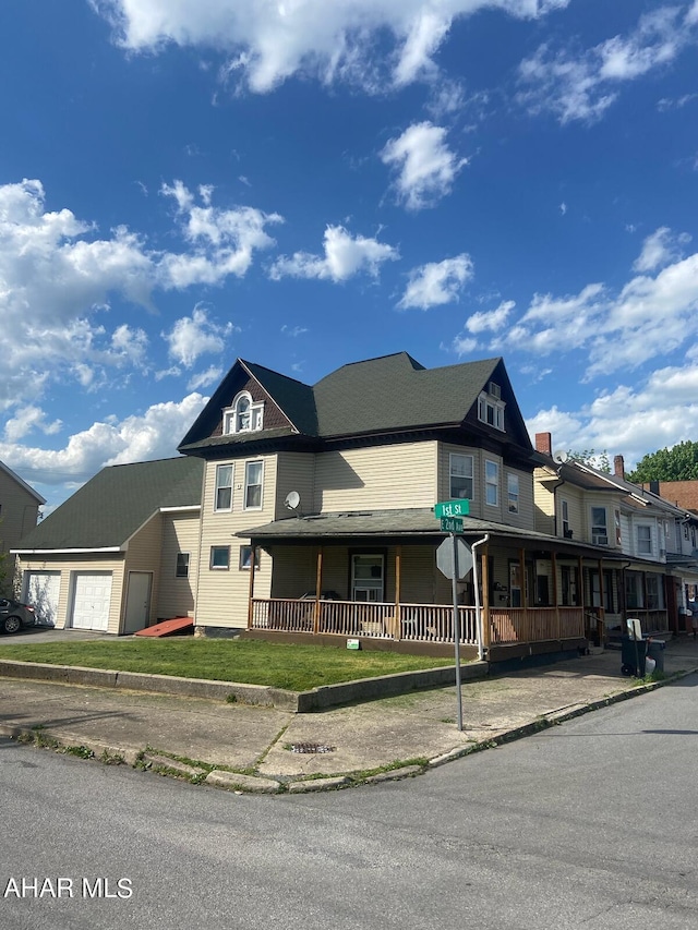 view of front of house with a porch and a garage