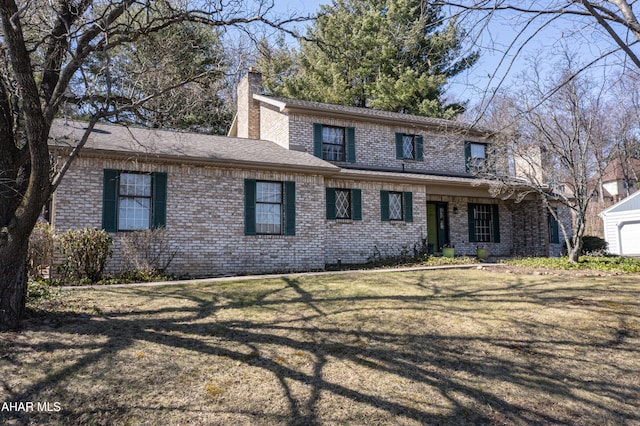 316 Ridge Ave, Altoona, PA 16602 - traditional-style home with brick siding, a chimney, a front lawn, and a shingled roof