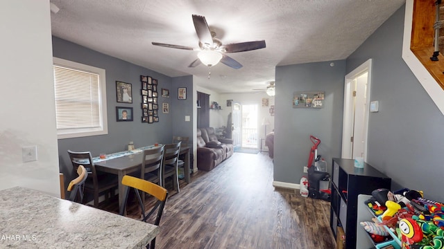 1407 N 5th Ave, Altoona, PA 16601 - dining space with a ceiling fan, dark wood finished floors, and a textured ceiling