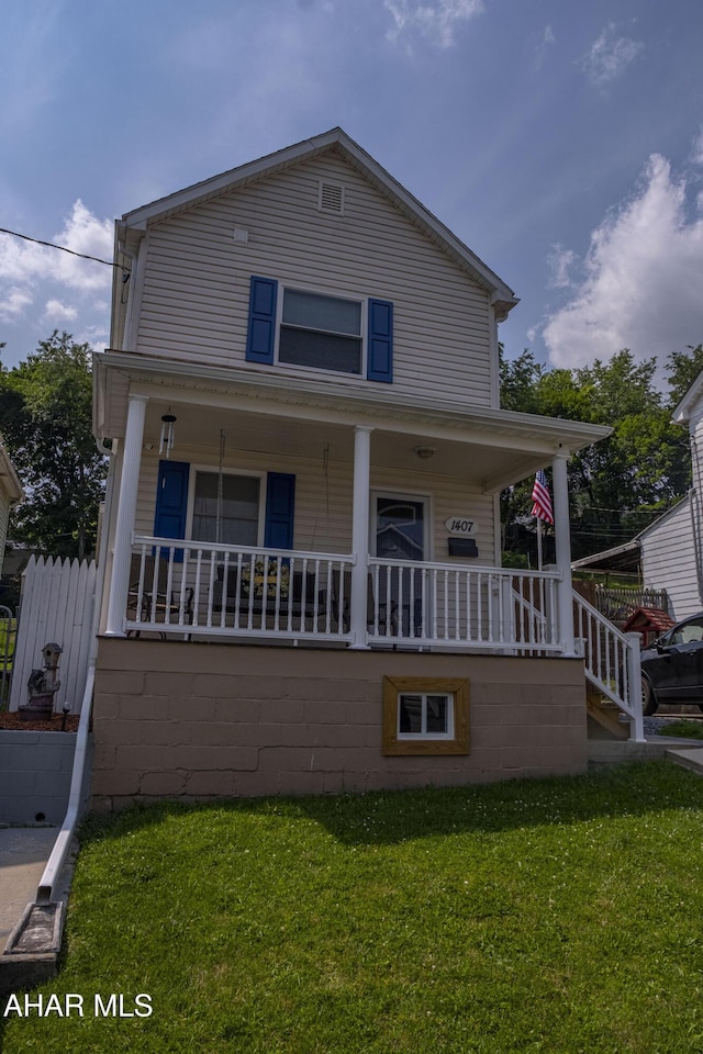 1407 N 5th Ave, Altoona, PA 16601 - view of front facade with covered porch and a front yard