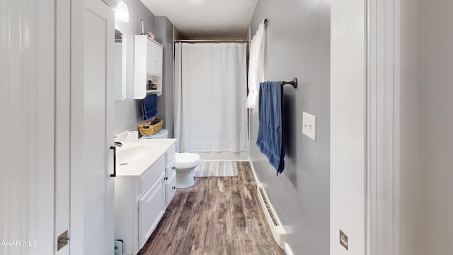 1407 N 5th Ave, Altoona, PA 16601 - full bathroom featuring vanity, a baseboard heating unit, and wood finished floors