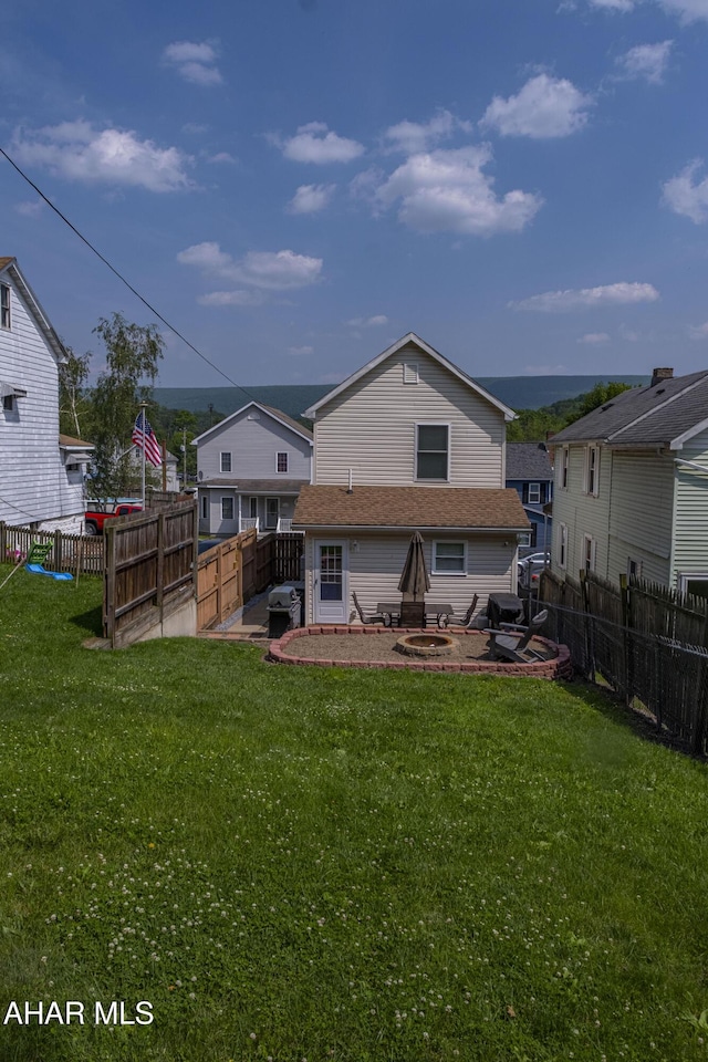 1407 N 5th Ave, Altoona, PA 16601 - back of property featuring a fenced backyard and an outdoor fire pit