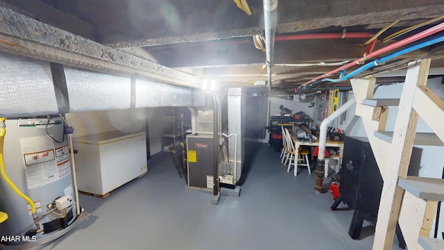 1407 N 5th Ave, Altoona, PA 16601 - unfinished below grade area featuring gas water heater and refrigerator