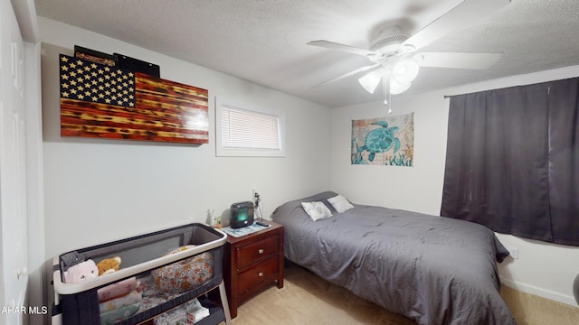 1407 N 5th Ave, Altoona, PA 16601 - bedroom featuring light carpet, a ceiling fan, and a textured ceiling
