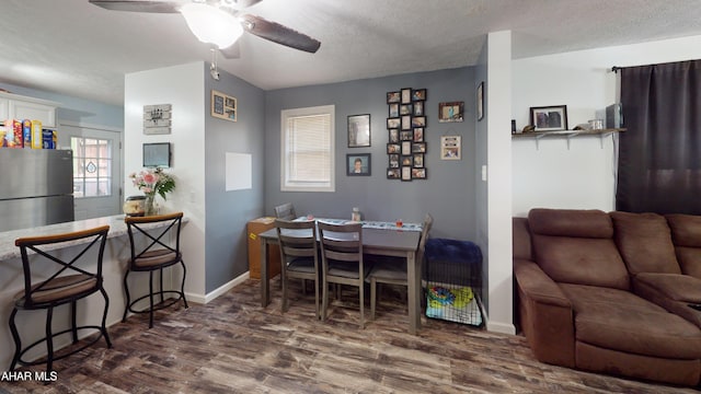 1407 N 5th Ave, Altoona, PA 16601 - dining area with wood finished floors, a ceiling fan, and a textured ceiling
