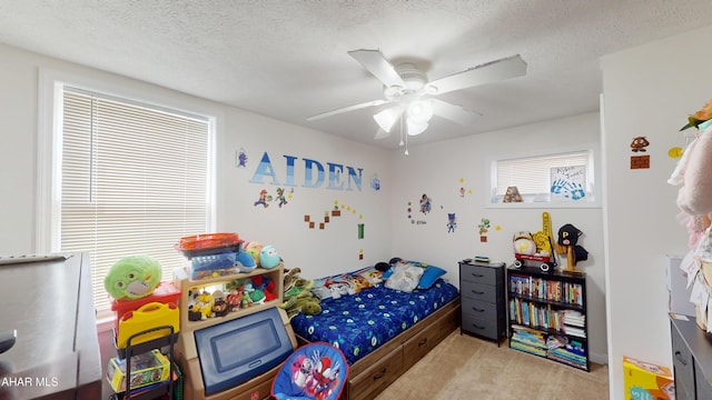 1407 N 5th Ave, Altoona, PA 16601 - carpeted bedroom featuring a textured ceiling and a ceiling fan