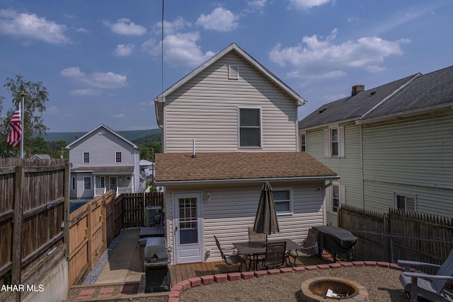 1407 N 5th Ave, Altoona, PA 16601 - rear view of property with a fire pit, a patio area, and a fenced backyard