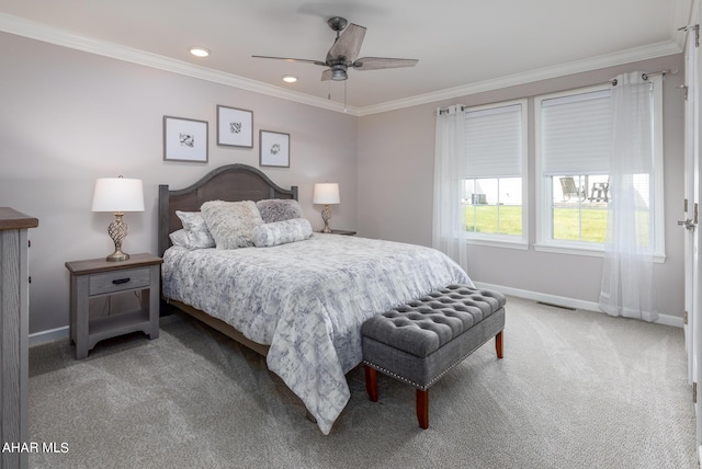 bedroom featuring ceiling fan, carpet floors, and ornamental molding