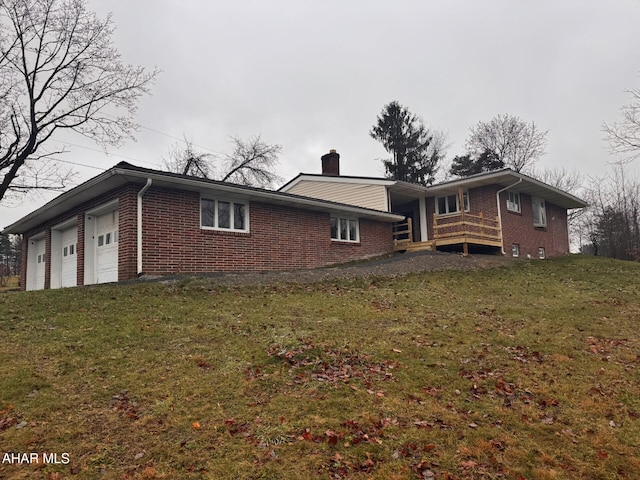 view of home's exterior with a yard and a garage