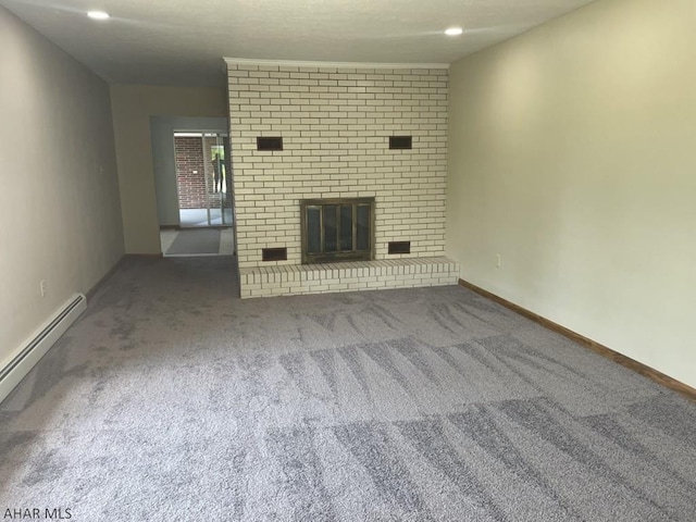 unfurnished living room featuring carpet flooring, a fireplace, and a baseboard radiator