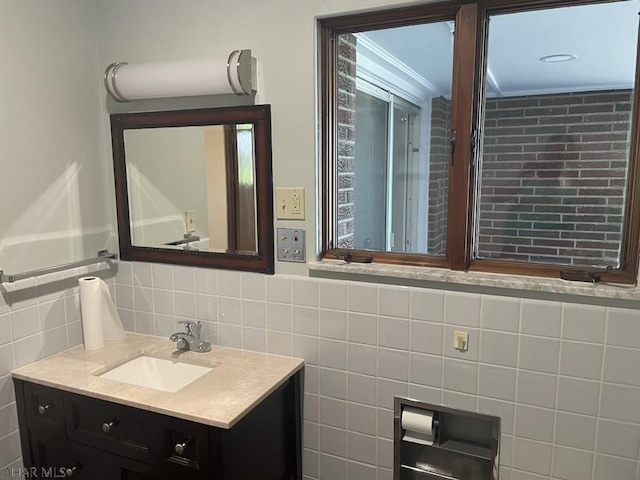 bathroom featuring vanity and tile walls