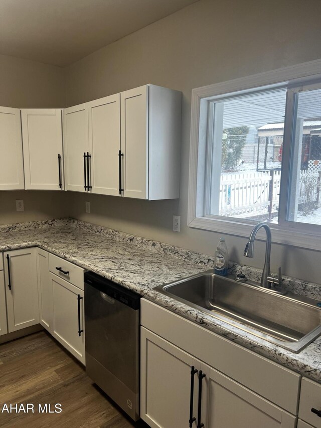 1327 2nd Ave, Altoona, PA 16602 - kitchen featuring dishwasher, a sink, white cabinetry, and dark wood-style floors