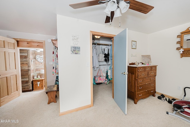 carpeted bedroom with a closet and ceiling fan