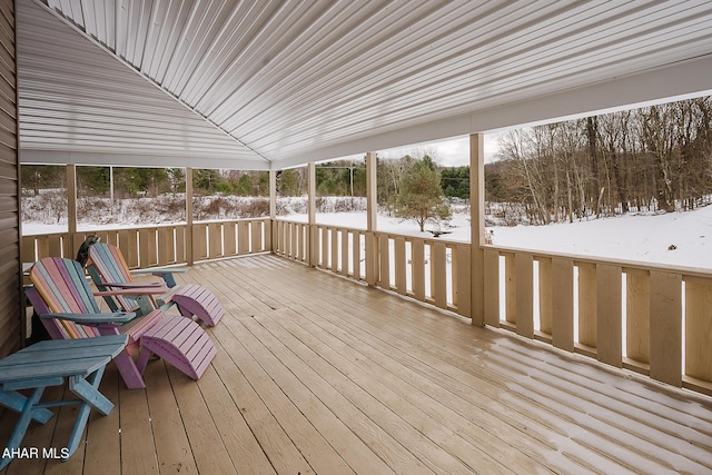 unfurnished sunroom with vaulted ceiling