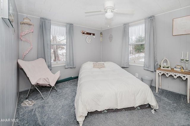 bedroom with dark carpet and ceiling fan