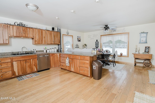 kitchen featuring kitchen peninsula, light hardwood / wood-style flooring, dishwasher, ceiling fan, and sink