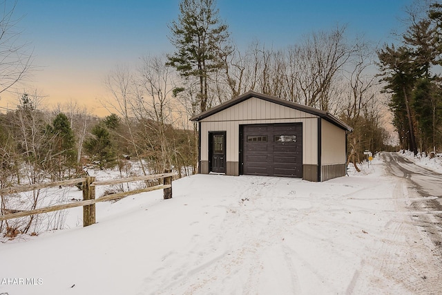 view of snow covered garage