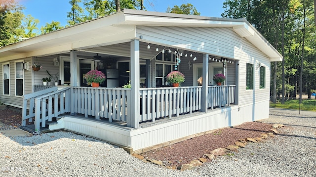 view of side of property featuring a porch