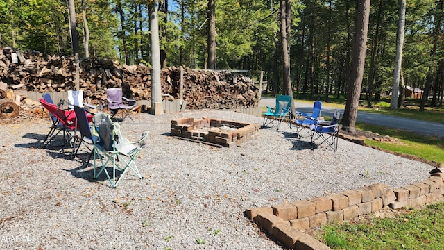 view of yard with a fire pit