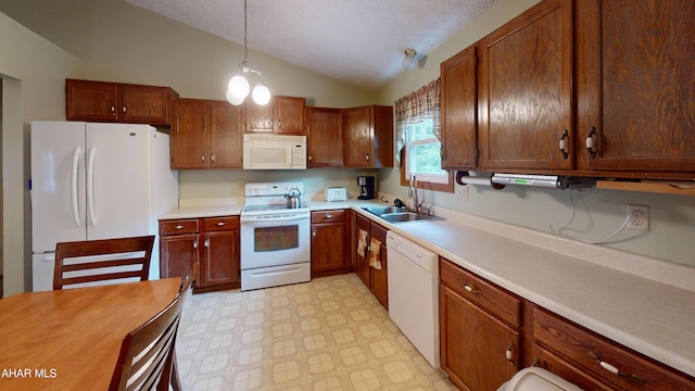 1647 Saint Francis Ln, Altoona, PA 16602 - kitchen with white appliances, vaulted ceiling, light floors, light countertops, and pendant lighting