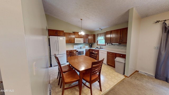 1647 Saint Francis Ln, Altoona, PA 16602 - kitchen with white appliances, a textured ceiling, light countertops, lofted ceiling, and decorative light fixtures