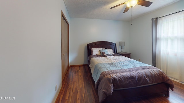 1647 Saint Francis Ln, Altoona, PA 16602 - bedroom featuring wood finished floors, a textured ceiling, a ceiling fan, and a closet