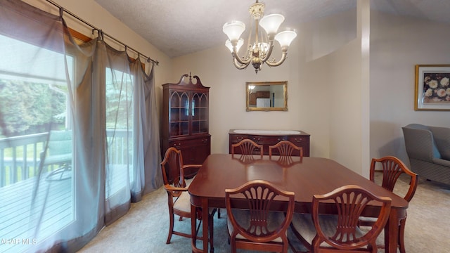 1647 Saint Francis Ln, Altoona, PA 16602 - dining space featuring light colored carpet, a chandelier, and vaulted ceiling