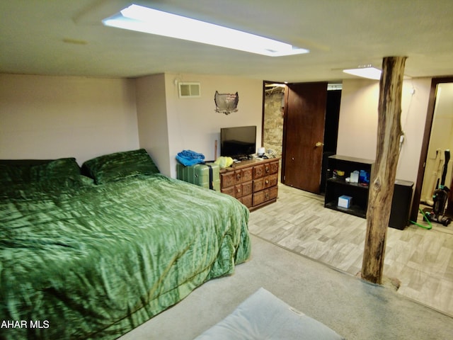 bedroom featuring light colored carpet