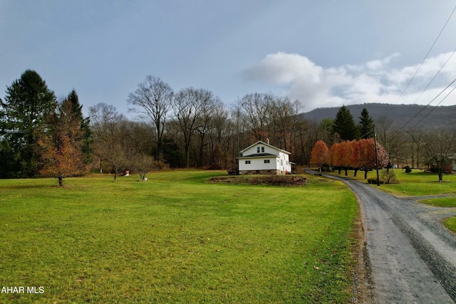 view of yard with a rural view