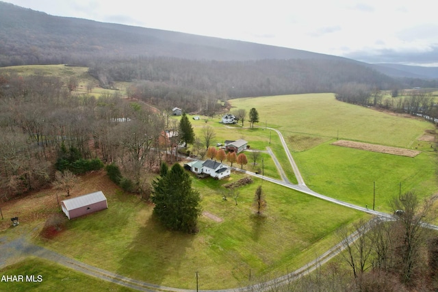 drone / aerial view featuring a mountain view and a rural view