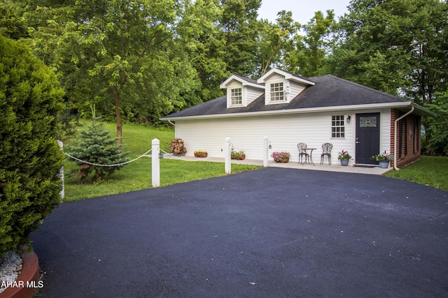 259 Chimney Rocks Rd, Hollidaysburg, PA 16648 - cape cod home featuring asphalt driveway, a front yard, and a shingled roof