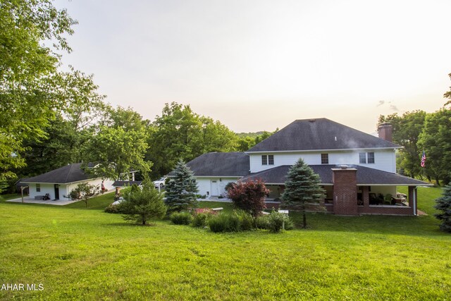 259 Chimney Rocks Rd, Hollidaysburg, PA 16648 - back of property featuring a lawn and a chimney