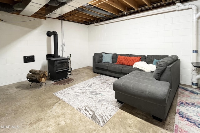 259 Chimney Rocks Rd, Hollidaysburg, PA 16648 - living area with unfinished concrete floors and a wood stove