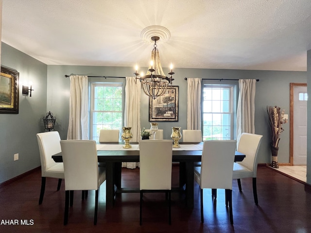259 Chimney Rocks Rd, Hollidaysburg, PA 16648 - dining area with a chandelier, plenty of natural light, baseboards, and a textured ceiling