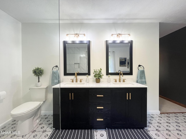 259 Chimney Rocks Rd, Hollidaysburg, PA 16648 - full bathroom featuring double vanity, toilet, a textured ceiling, and baseboards