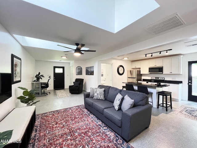 259 Chimney Rocks Rd, Hollidaysburg, PA 16648 - living area with a skylight, rail lighting, ceiling fan, and a desk