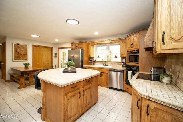 259 Chimney Rocks Rd, Hollidaysburg, PA 16648 - kitchen featuring black appliances, a sink, light tile patterned flooring, tile counters, and decorative backsplash