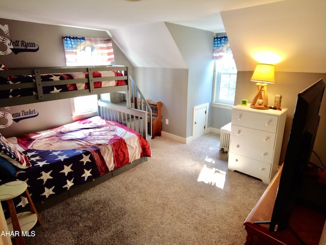 bedroom featuring carpet and vaulted ceiling