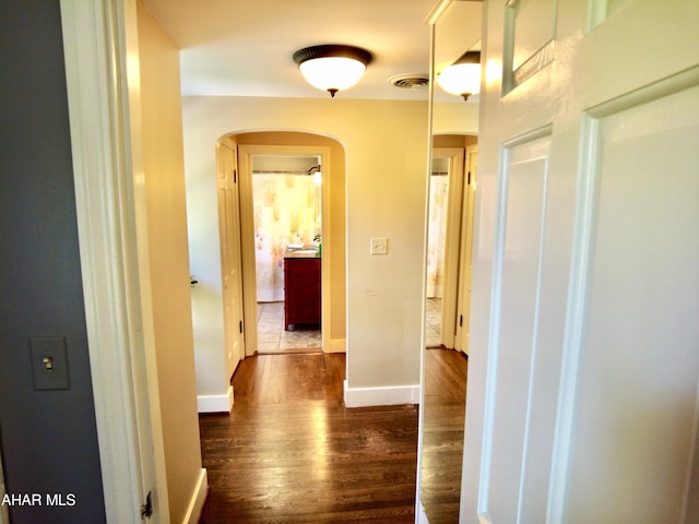 hallway featuring dark hardwood / wood-style floors