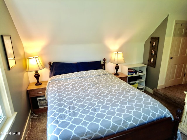 carpeted bedroom featuring vaulted ceiling